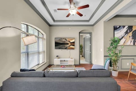 Sink into a cozy couch and stream your favorite movies in the living room's inviting ambiance.
