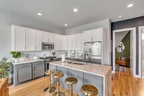 The sophisticated kitchen offers ample space & every home comfort