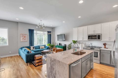 The sophisticated kitchen offers ample space & every home comfort