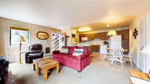 Living room with sofa sleeper, flat screen TV, and fireplace