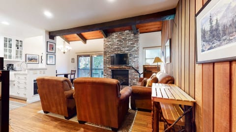 Living room with flat screen TV, gas fireplace and comfortable seating