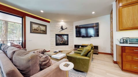 Curl up for a movie or enjoy a warming fire in the living room’s gas fireplace
