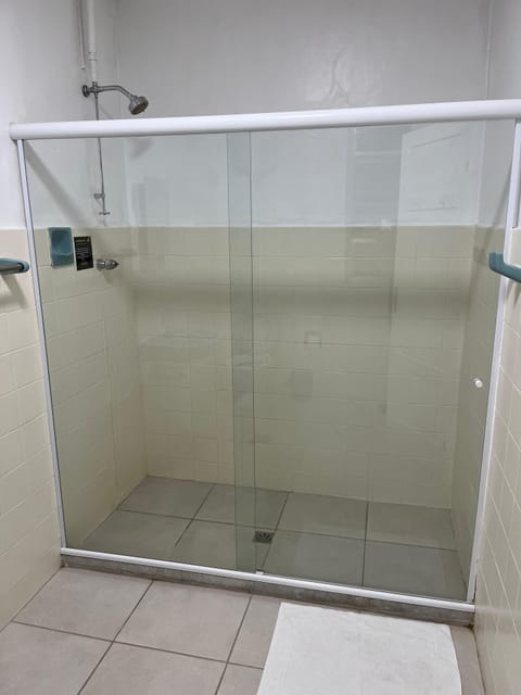 Shower, designer toiletries, hair dryer, towels