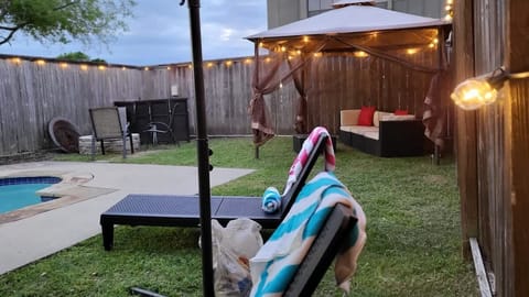 Backyard ready for sunbathing, laughter, and refreshing afternoon dips.