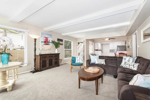 A welcoming living space filled with natural light, offering an inviting atmosphere for gathering with friends and family
                