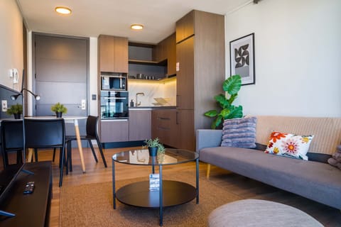 Cozy and stylish living space with a modern kitchen, perfect for relaxing after exploring the city.