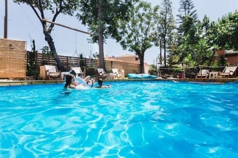 Seasonal outdoor pool, open 10:00 AM to 7:00 PM, sun loungers