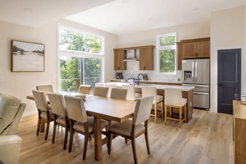 The dining area comfortably seats 8 at the table.