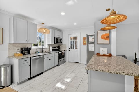 Cook with ease in the fully equipped kitchen, complete with stainless steel appliances, granite counters, and plenty of space to create.