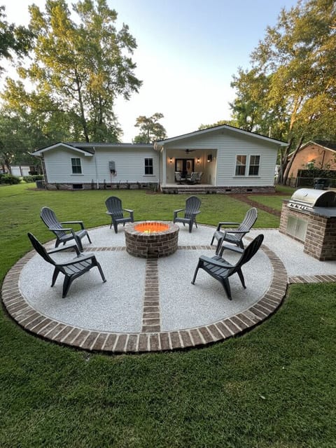 Gather around the brick firepit for s`mores and stories under the Charleston sky - your own backyard oasis with room for everyone to spread out