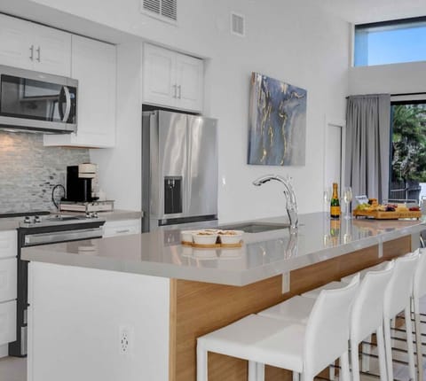 Chefs kitchen, island seating for 6, quartz countertops, stainless steel