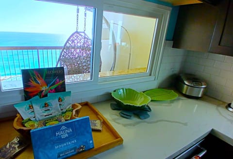 View from kitchen with egg swing chair on massive balcony!