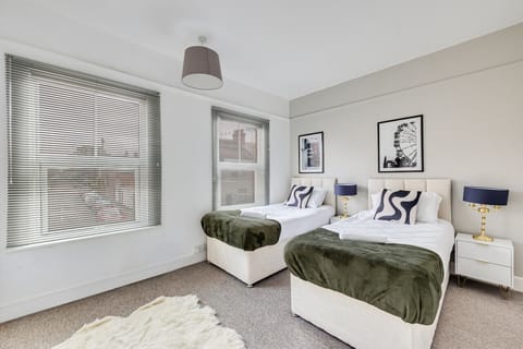 Bedroom 1 with comfortable zip and link beds which is configured as two single beds by default or can be zipped together to form a king size bed upon request.