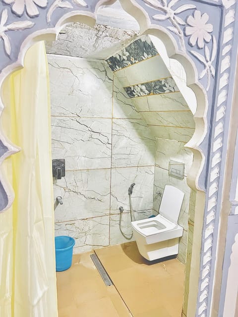 Deluxe Room, Patio, Garden View | Bathroom | Shower, free toiletries, slippers, soap