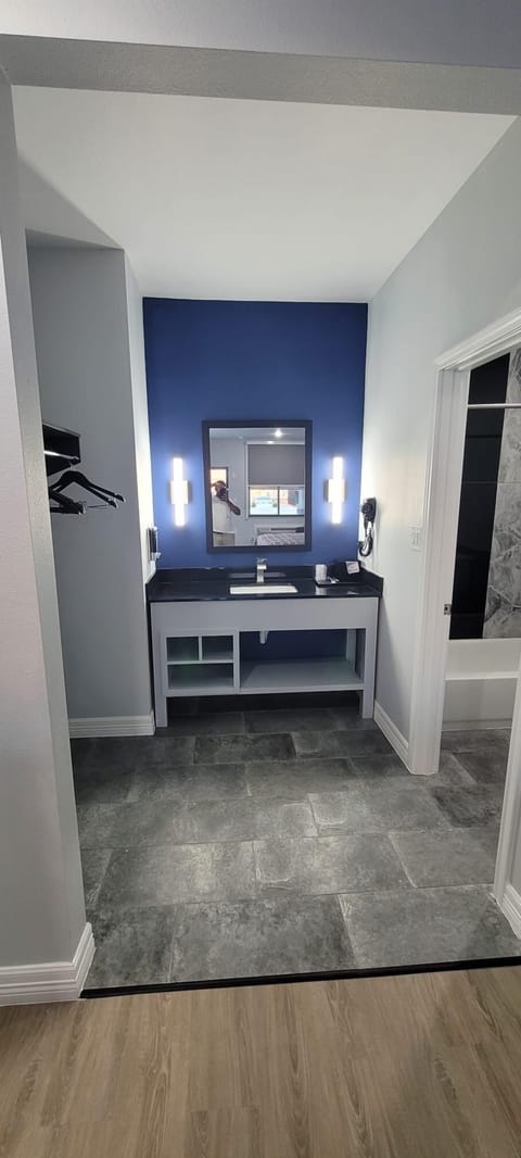 Bathtub, hair dryer, towels, soap