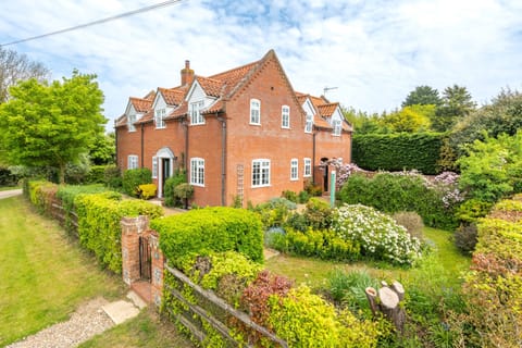 Scarrowbeck House, Hanworth: Front elevation showing the established garden