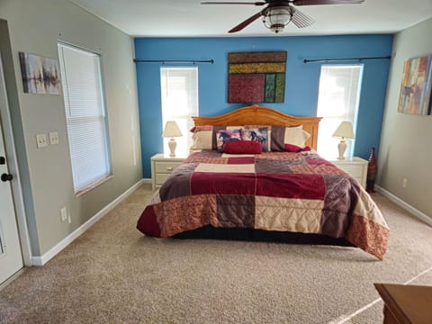 Master Bedroom with King bed and doorway to lanai.