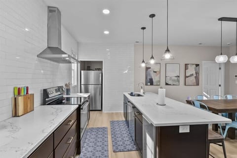 Kitchen: The heart of the home—modern appliances and sleek design make this kitchen a culinary haven.
