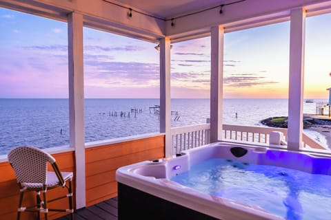 Enjoy a soak at sunset in the private hot tub, directly overlooking the Gulf. Waffle spa robes & spa towels included.