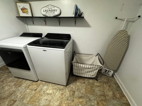 laundry room, ironing board and iron.