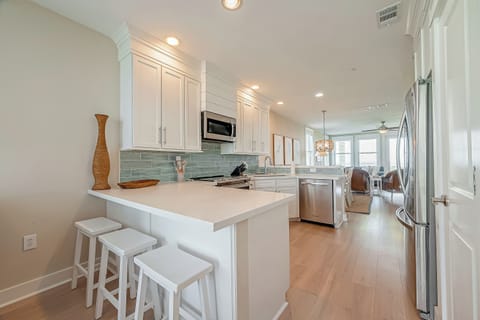The kitchen is open to the living room and flex room. Bar seating!