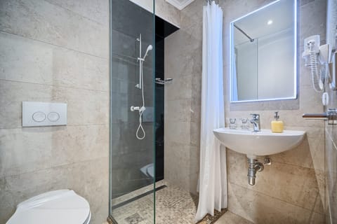 Standard Double Room | Bathroom | Shower, hair dryer, towels, soap