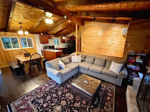 The living room is an open layout to the kitchen and dining room