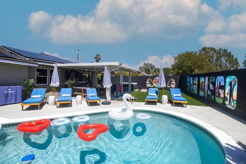 Super spacious backyard with thermal solar heated pool with 8ft deep end and 3.5 ft shallow end, hot tub, corn hole, connect 4, and jenga