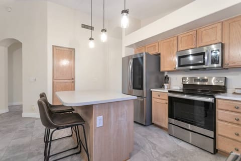 Kitchen with fridge, flattop stove, dishwasher, traditional/ & Keurig coffee maker