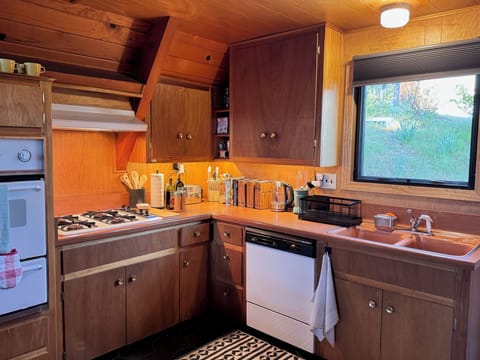 Nutribullet blender, electric kettle, French Press, stovetop espresso maker.