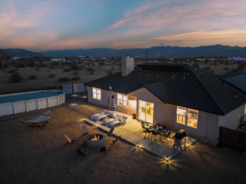 Desert evenings made perfect with a glowing fire pit, pool, and spacious patio.