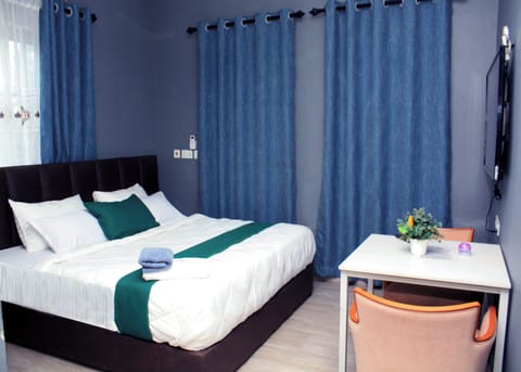 Luxury Suite, Balcony, City View | Minibar, desk, WiFi (free), individually decorated