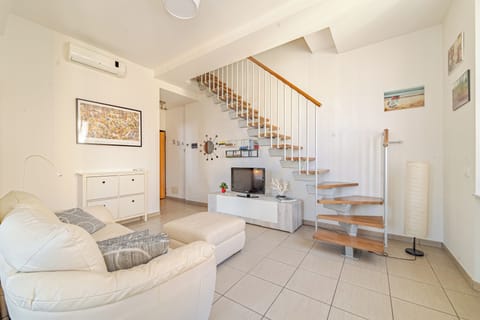Duplex | Living area | 24-inch flat-screen TV with digital channels