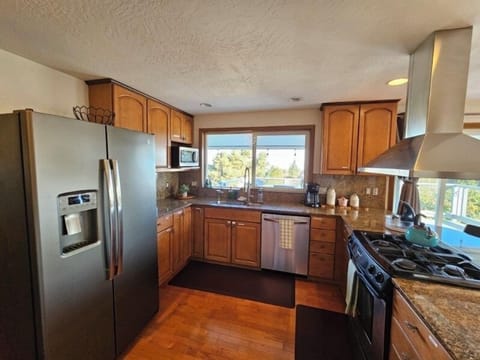 Upstairs full kitchen off the master bedroom#1 and the upstairs balcony.