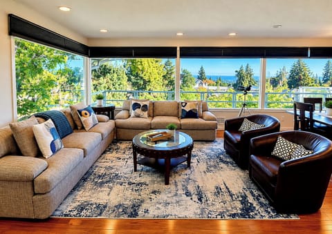 Upstairs living room, feels like you’re in the trees, great view of the water.