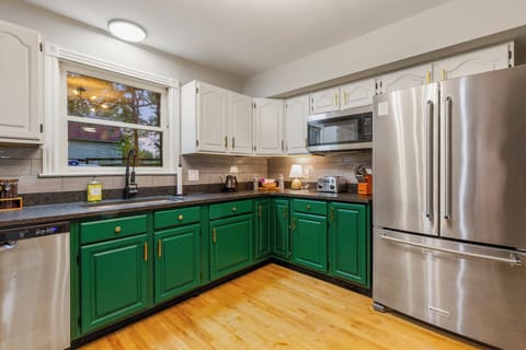 Spacious kitchen with brand new stainless appliances and granite countertops