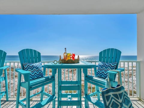 Sip your morning coffee or evening cocktail from these turquoise chairs while gulf waves sparkle endlessly before you.