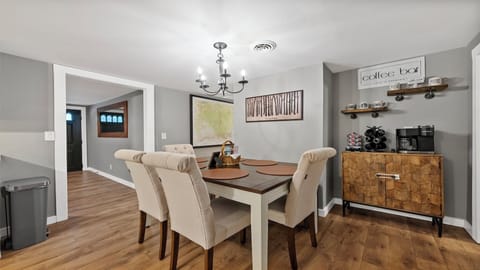 A warm and inviting kitchen table, ideal for sharing meals and memories together