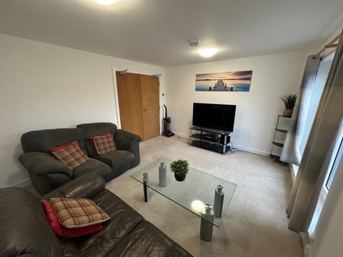 Lounge area with large TV