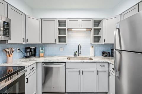 Bright kitchen space with marble counters and seamless daily function.