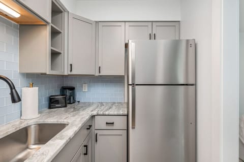 Sophisticated kitchen entry with premium finishes and curated visual appeal.