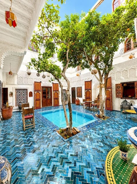 Outdoor pool, open 9:30 AM to 11:00 PM, pool umbrellas, sun loungers