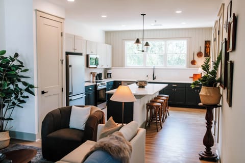 Experience the beauty of our open floor plan in this stylish and chic space. The seamless flow between the living, dining, and kitchen areas creates an inviting atmosphere perfect for entertaining or relaxing.