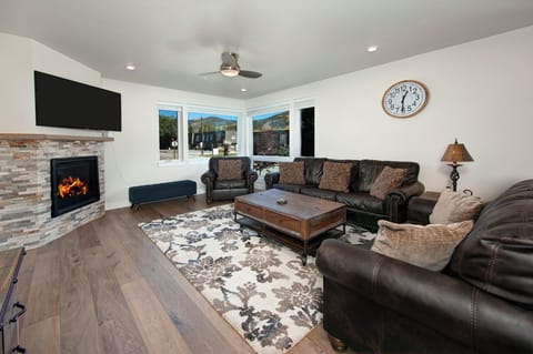Enjoy a nice cup of coffee by the fire in this spacious living area.