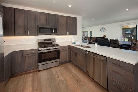 Gorgeous kitchen with stainless steel appliances. Fully stocked with everything to make delicious meals for the whole family!