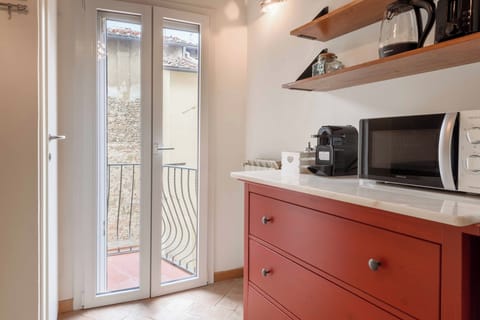 Deluxe Apartment, Balcony | Private kitchen | Fridge, stovetop