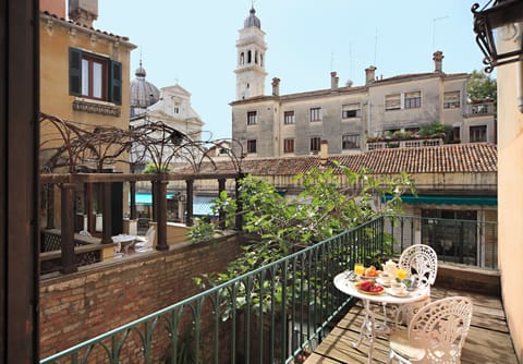 Deluxe Room, Terrace, Canal View | Minibar, in-room safe, desk, soundproofing