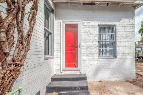 Front door to the Red door. Only one with a red door it's in the back.