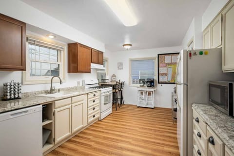 The fully equipped kitchen is ready for all your culinary adventures, with a quaint two-seat dining nook ideal for morning coffee or evening wine.