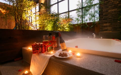 Garden Suite | Bathroom | Separate tub and shower, deep soaking tub, designer toiletries